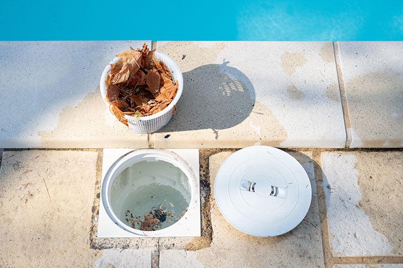 Cleaning Out a Pool Skimmer Basket