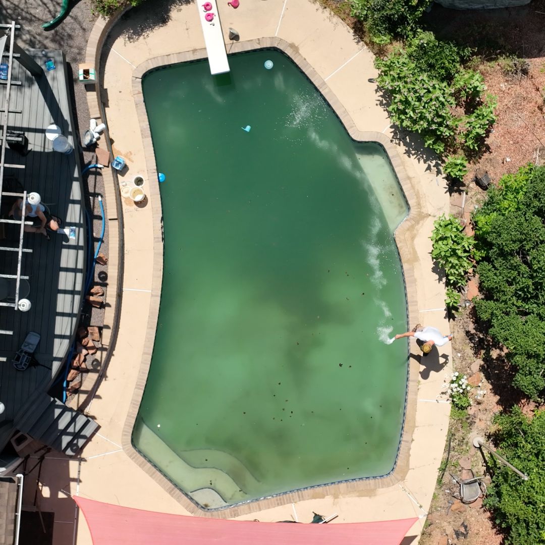 Drone Shot of Green Inground Pool Water