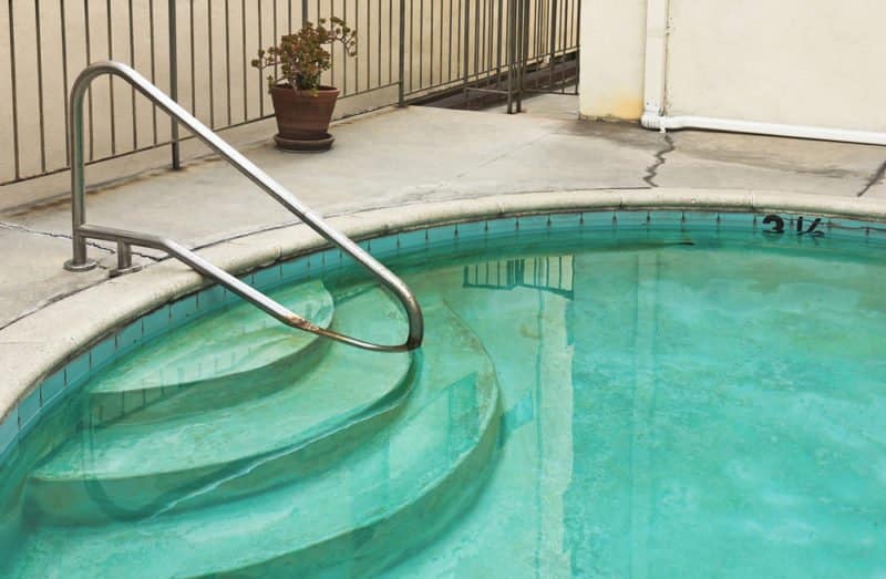 Greenish stains on the pool walls and floors may be an indication of too much copper in your pool water.